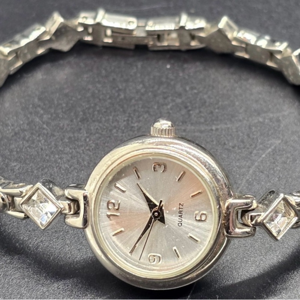 Silver Bracelet Watch with Textured Links and Simple Dial